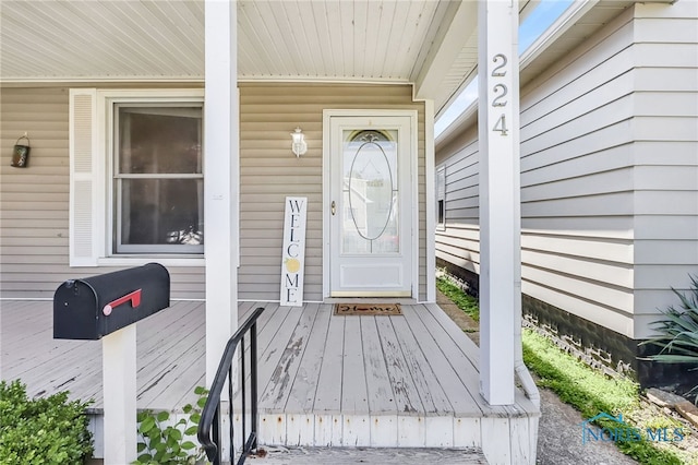 224 Elm St, Rossford, OH 43460 - view of exterior entry featuring a porch