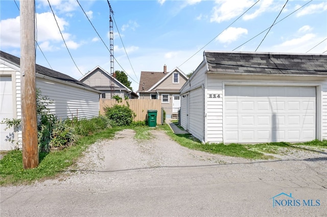 224 Elm St, Rossford, OH 43460 - detached garage with dirt driveway