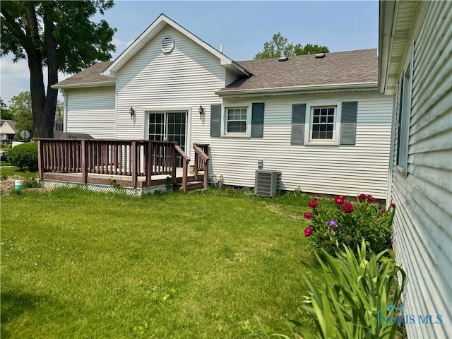 1001 Wilhelm St, Defiance, OH 43512 - back of house with a lawn, cooling unit, a wooden deck, and a shingled roof