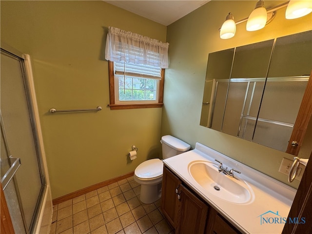 1001 Wilhelm St, Defiance, OH 43512 - bathroom with a shower with door, toilet, vanity, tile patterned flooring, and baseboards