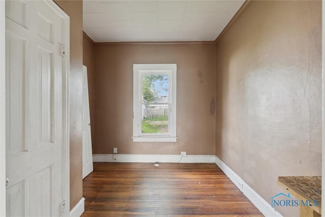 715 Nicholas St, Toledo, OH 43609 - spare room with hardwood / wood-style flooring, baseboards, and ornamental molding