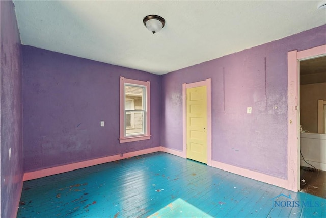 715 Nicholas St, Toledo, OH 43609 - spare room with wood finished floors, baseboards, and a smoke detector