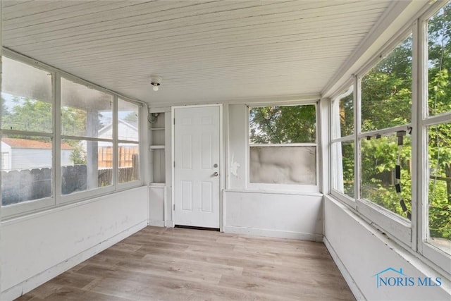 715 Nicholas St, Toledo, OH 43609 - unfurnished sunroom featuring wood finished floors and wooden ceiling