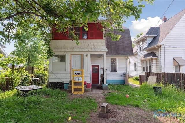 715 Nicholas St, Toledo, OH 43609 - rear view of property featuring entry steps and a shingled roof