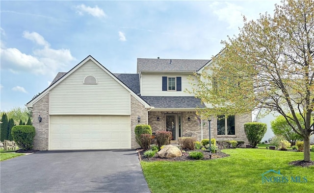 7663 Cortland Ct, Holland, OH 43528 - traditional-style house featuring driveway, a shingled roof, a front lawn, brick siding, and a garage