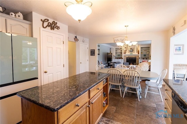 7663 Cortland Ct, Holland, OH 43528 - kitchen with freestanding refrigerator, dishwasher, built in features, a chandelier, and a center island