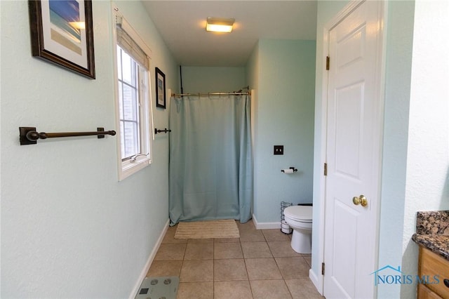 7663 Cortland Ct, Holland, OH 43528 - full bathroom with toilet, vanity, baseboards, tile patterned floors, and a shower with shower curtain