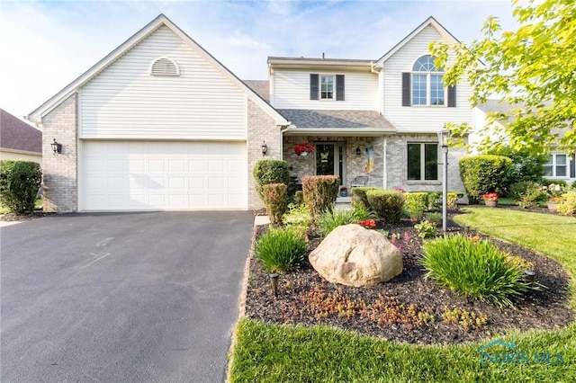 7663 Cortland Ct, Holland, OH 43528 - traditional-style home featuring driveway, an attached garage, brick siding, and roof with shingles