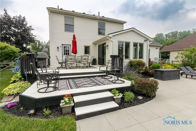 7663 Cortland Ct, Holland, OH 43528 - back of house featuring outdoor dining space and a wooden deck
