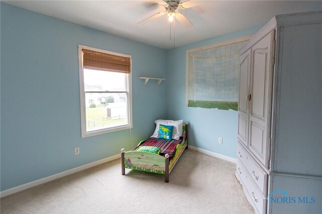 7663 Cortland Ct, Holland, OH 43528 - bedroom with light carpet, baseboards, and ceiling fan