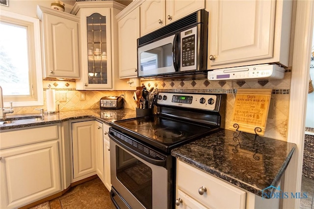 7663 Cortland Ct, Holland, OH 43528 - kitchen with electric stove, a sink, tasteful backsplash, and glass insert cabinets