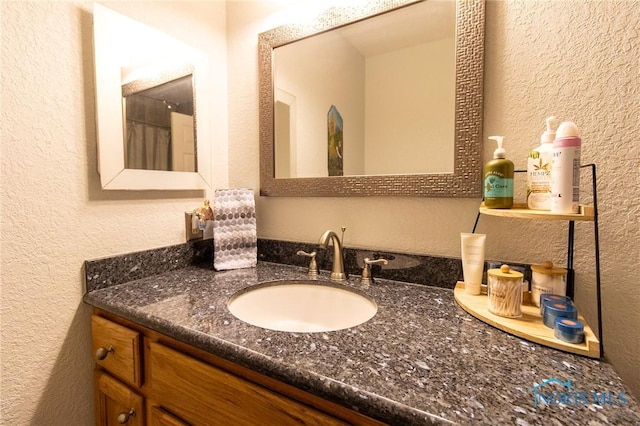7663 Cortland Ct, Holland, OH 43528 - full bath featuring a textured wall and vanity