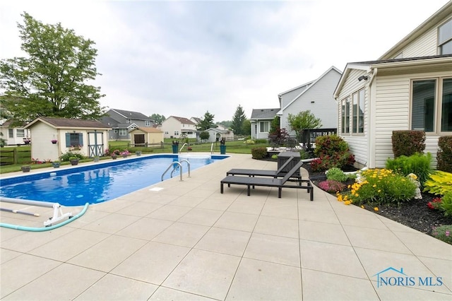 7663 Cortland Ct, Holland, OH 43528 - outdoor pool featuring a patio area and a residential view