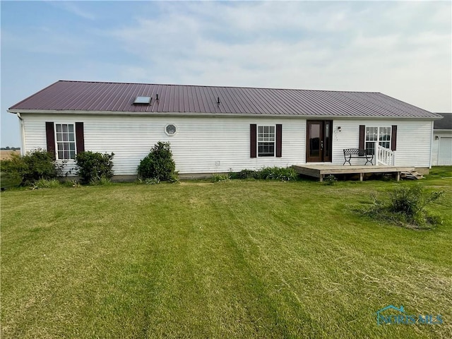 7774 Scott Rd, Edgerton, OH 43517 - rear view of house featuring a deck, a yard, and metal roof