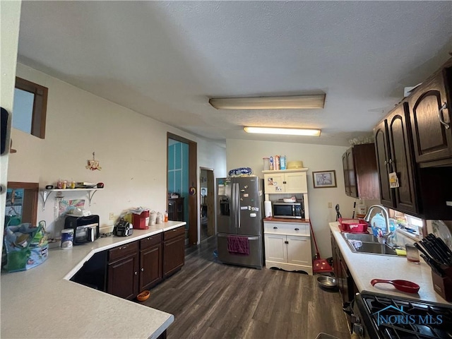 7774 Scott Rd, Edgerton, OH 43517 - kitchen with appliances with stainless steel finishes, light countertops, a sink, and dark wood finished floors