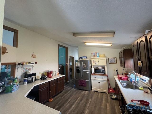 7774 Scott Rd, Edgerton, OH 43517 - kitchen featuring appliances with stainless steel finishes, a sink, light countertops, and dark wood-style flooring