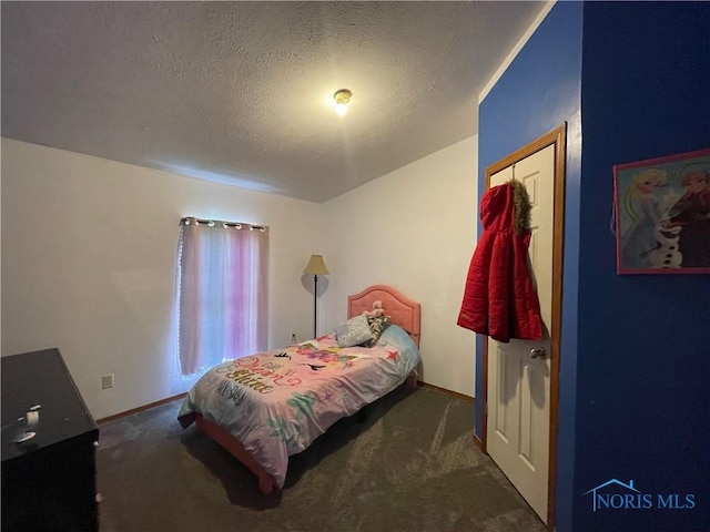 7774 Scott Rd, Edgerton, OH 43517 - carpeted bedroom with a textured ceiling and baseboards