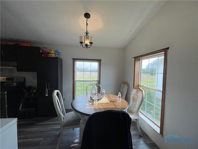 7774 Scott Rd, Edgerton, OH 43517 - dining space featuring lofted ceiling, healthy amount of natural light, dark wood-style flooring, and a chandelier