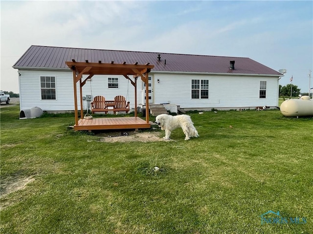 7774 Scott Rd, Edgerton, OH 43517 - back of property featuring a deck, a yard, and metal roof