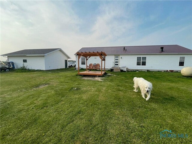 7774 Scott Rd, Edgerton, OH 43517 - back of house featuring a deck, a yard, and metal roof