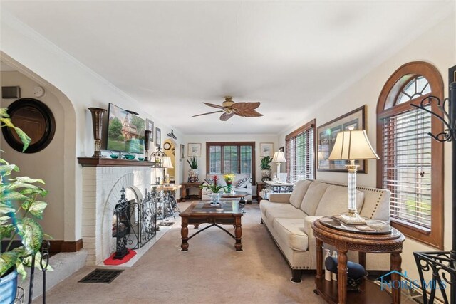 2917 Goddard Rd, Toledo, OH 43606 - carpeted living area with a ceiling fan and a brick fireplace