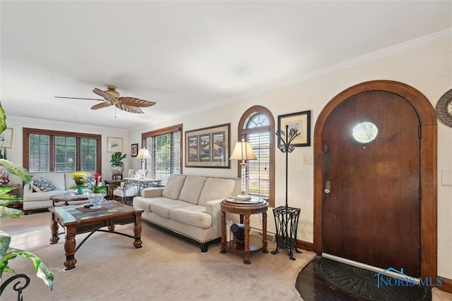2917 Goddard Rd, Toledo, OH 43606 - living room featuring healthy amount of natural light, arched walkways, ceiling fan, and ornamental molding