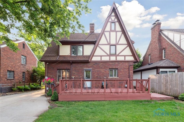 2917 Goddard Rd, Toledo, OH 43606 - back of property featuring stucco siding, brick siding, and a wooden deck