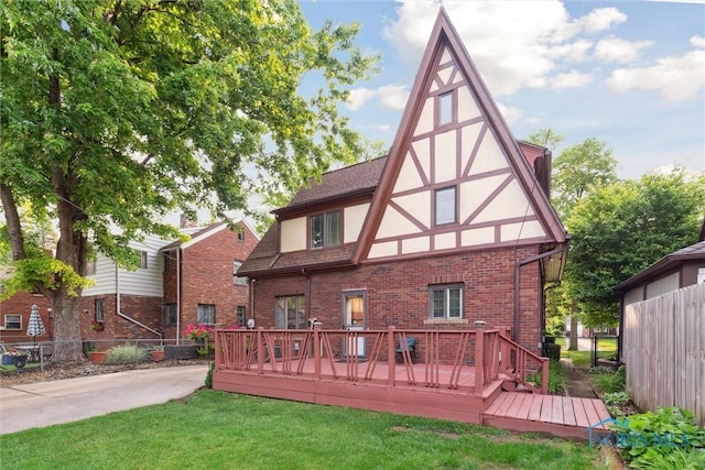 2917 Goddard Rd, Toledo, OH 43606 - back of house with stucco siding, brick siding, and a wooden deck