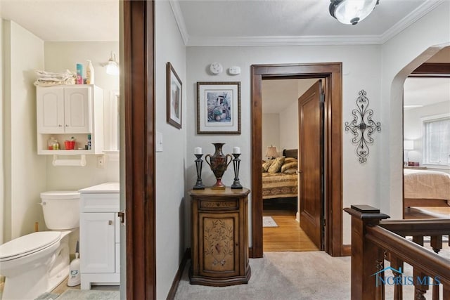 2917 Goddard Rd, Toledo, OH 43606 - hall featuring arched walkways, light colored carpet, and crown molding