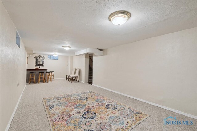 2917 Goddard Rd, Toledo, OH 43606 - finished below grade area with carpet floors and a textured ceiling