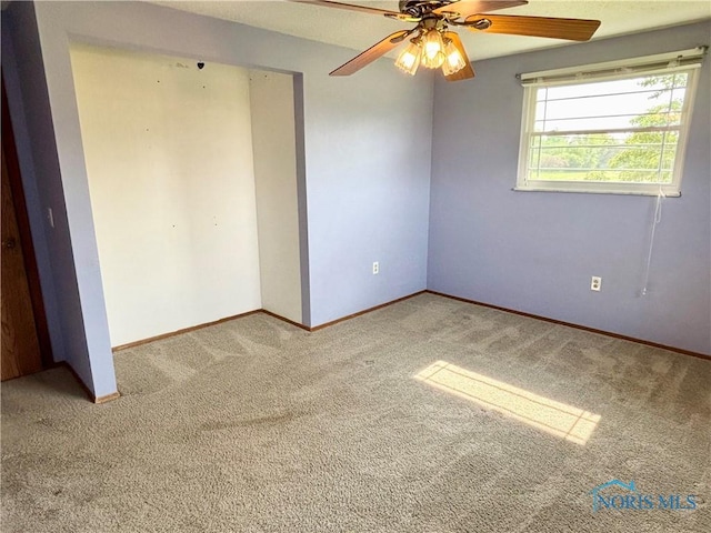 1105 S Lallendorf Rd, Oregon, OH 43616 - unfurnished bedroom with carpet flooring and a ceiling fan
