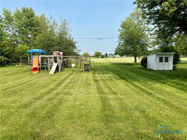 1105 S Lallendorf Rd, Oregon, OH 43616 - view of grassy yard featuring a playground and a storage shed