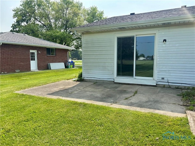 1105 S Lallendorf Rd, Oregon, OH 43616 - rear view of house featuring a patio and a yard
