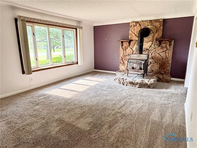 1105 S Lallendorf Rd, Oregon, OH 43616 - living area featuring a textured ceiling, a wood stove, and carpet floors