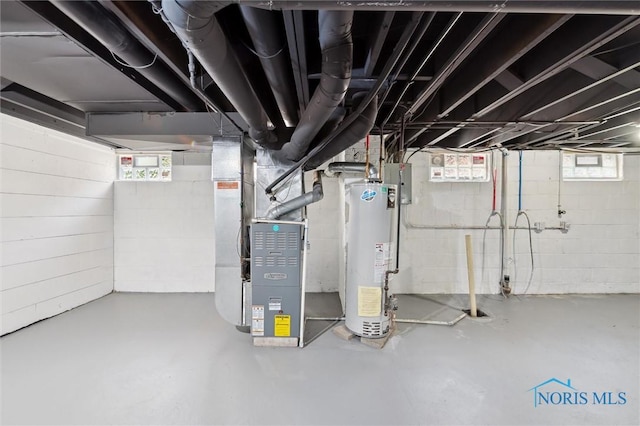 1006 Brookley Blvd, Toledo, OH 43607 - basement with gas water heater, healthy amount of natural light, and heating unit