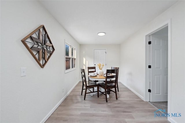 1006 Brookley Blvd, Toledo, OH 43607 - dining room with baseboards and light wood finished floors