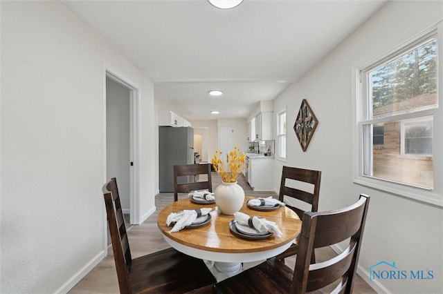 1006 Brookley Blvd, Toledo, OH 43607 - dining area featuring baseboards, light wood-style floors, and recessed lighting