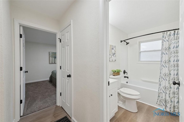 1006 Brookley Blvd, Toledo, OH 43607 - full bathroom featuring wood finished floors, shower / tub combo, toilet, and vanity