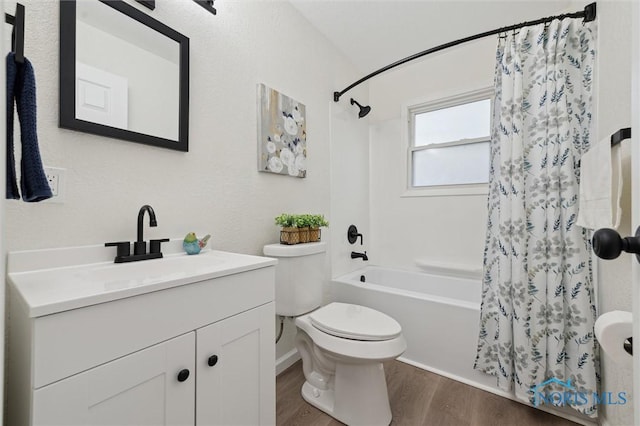 1006 Brookley Blvd, Toledo, OH 43607 - full bathroom with shower / bath combo, wood finished floors, toilet, and vanity