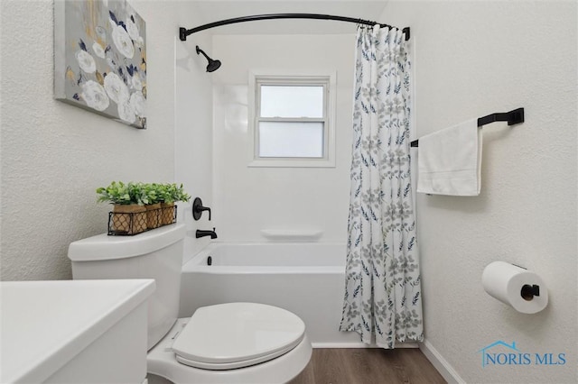 1006 Brookley Blvd, Toledo, OH 43607 - bathroom featuring toilet, shower / bathtub combination with curtain, wood finished floors, and baseboards