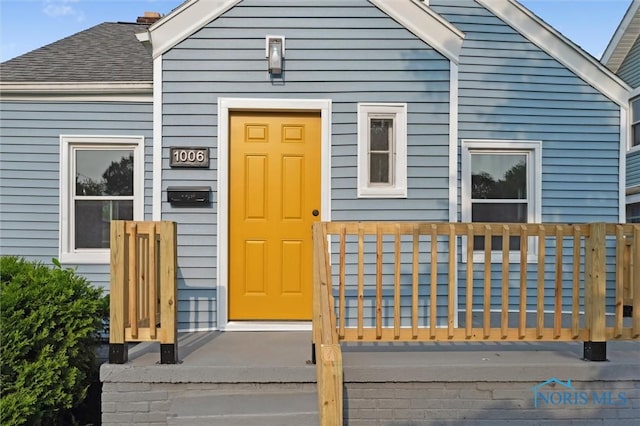 1006 Brookley Blvd, Toledo, OH 43607 - property entrance featuring a shingled roof
