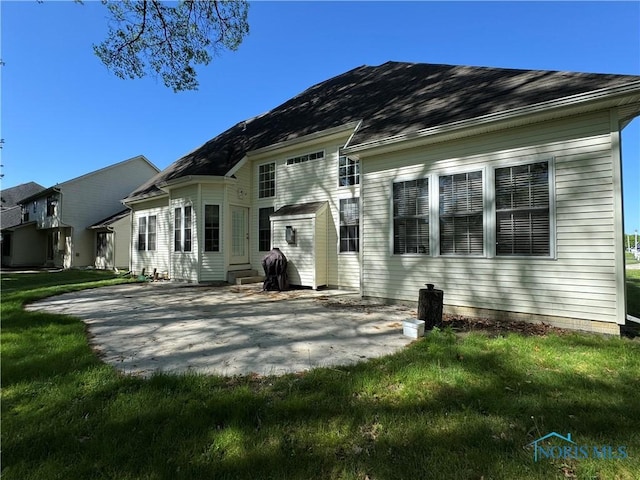8828 Cedar Bend Rd, Sylvania, OH 43560 - back of house with a patio and a lawn