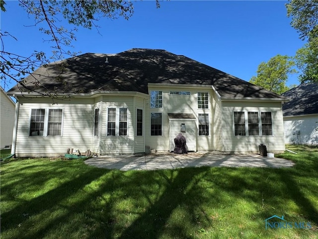 8828 Cedar Bend Rd, Sylvania, OH 43560 - back of property featuring a patio and a yard