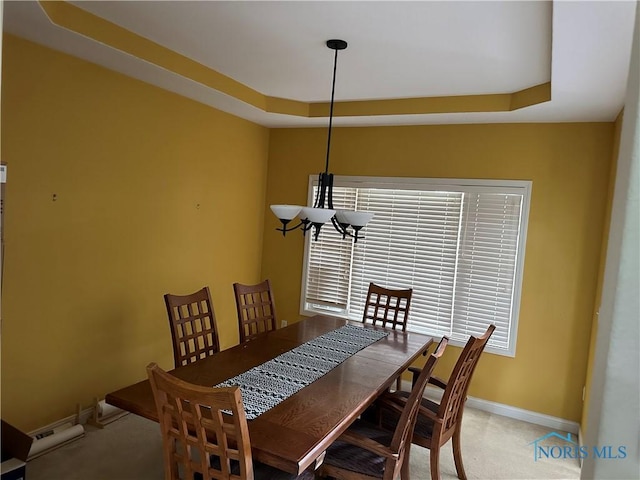 8828 Cedar Bend Rd, Sylvania, OH 43560 - dining room with a raised ceiling and light carpet
