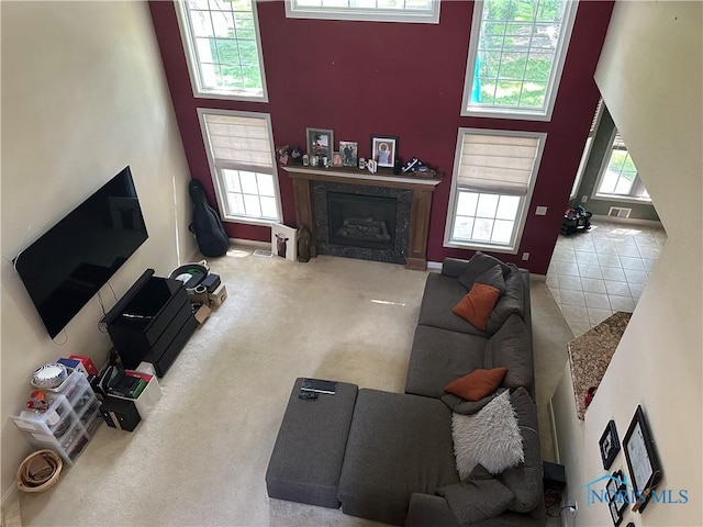 8828 Cedar Bend Rd, Sylvania, OH 43560 - living area with a towering ceiling, a fireplace, and carpet