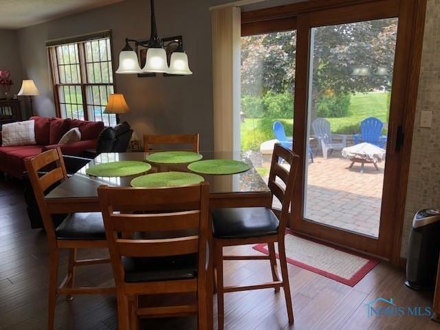 415 W Jamestown Ave, Tiffin, OH 44883 - dining room with a chandelier and wood finished floors