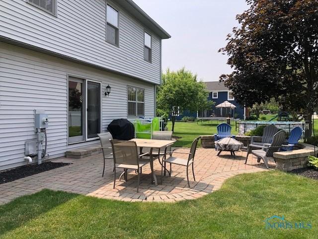 415 W Jamestown Ave, Tiffin, OH 44883 - view of patio featuring an outdoor fire pit