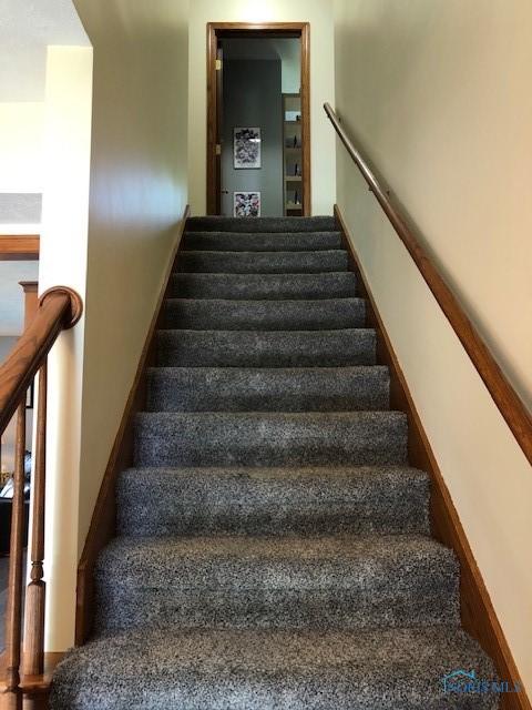 415 W Jamestown Ave, Tiffin, OH 44883 - staircase with baseboards