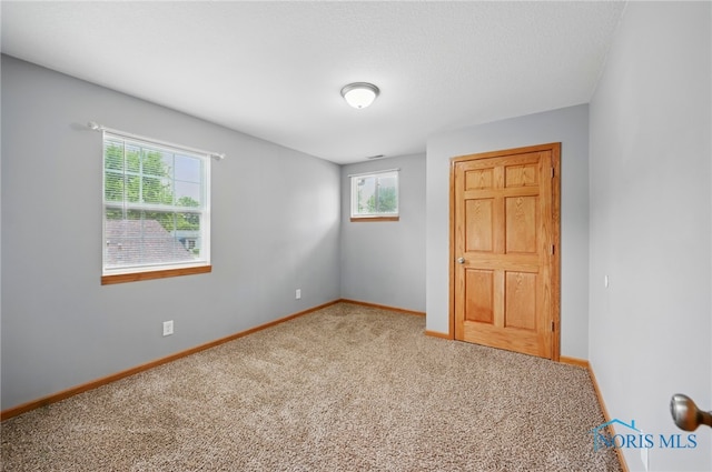 536 N Johnson St, Ada, OH 45810 - unfurnished bedroom with carpet and baseboards
