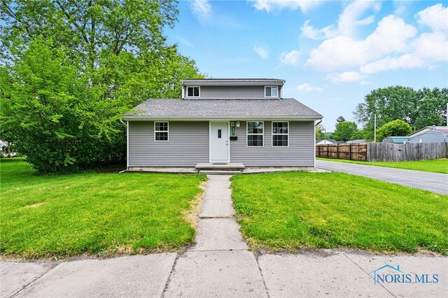 536 N Johnson St, Ada, OH 45810 - bungalow-style home with roof with shingles